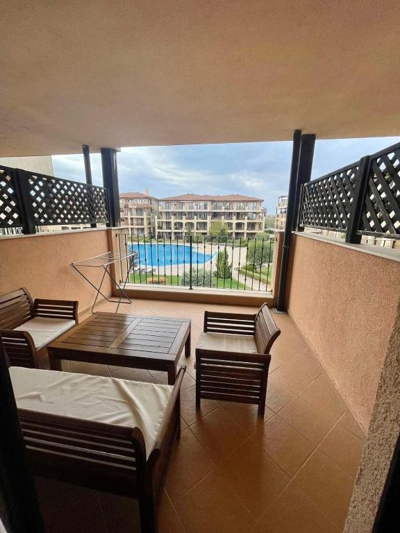 a balcony with a view of a building and a pool at Lux By Kaliakria in Topola