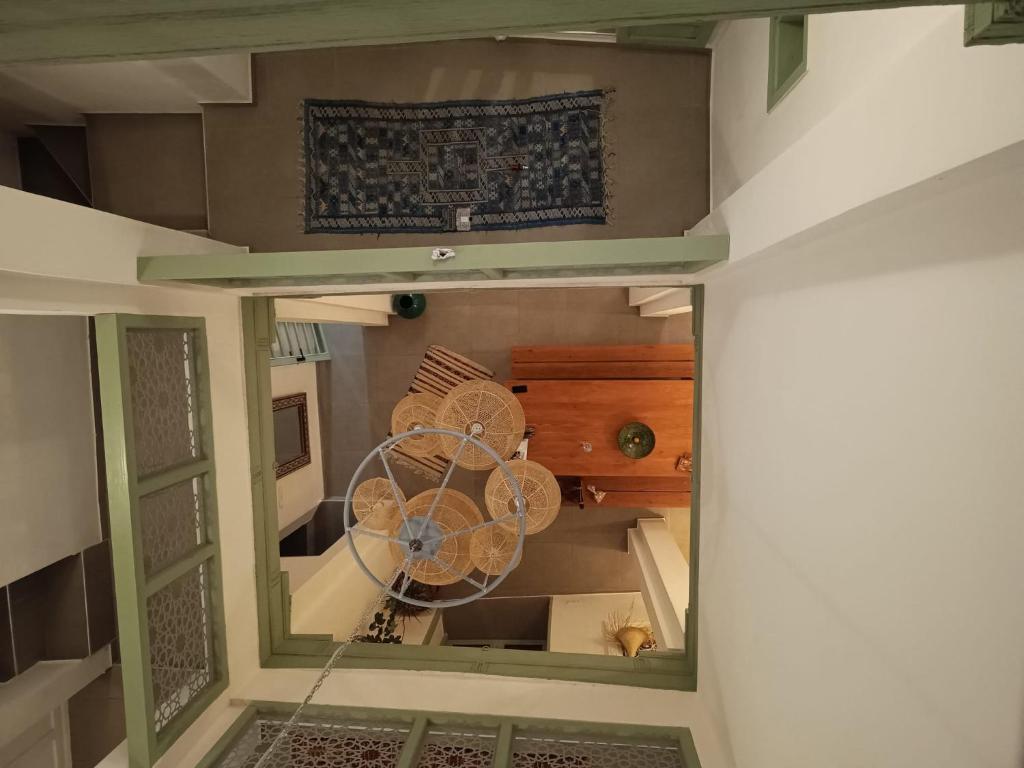 an overhead view of a room with a fan at La Maison des Amis in Fez