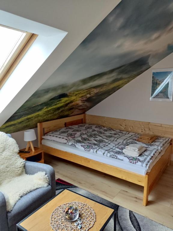 Postel nebo postele na pokoji v ubytování Apartamenty u drwala