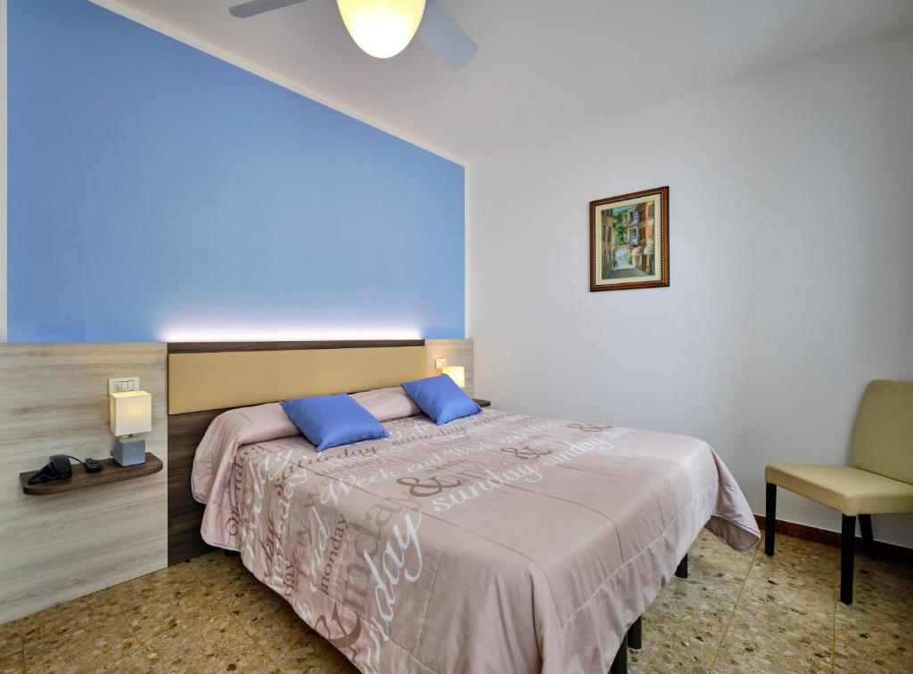 Postel nebo postele na pokoji v ubytování Piccolo Hotel