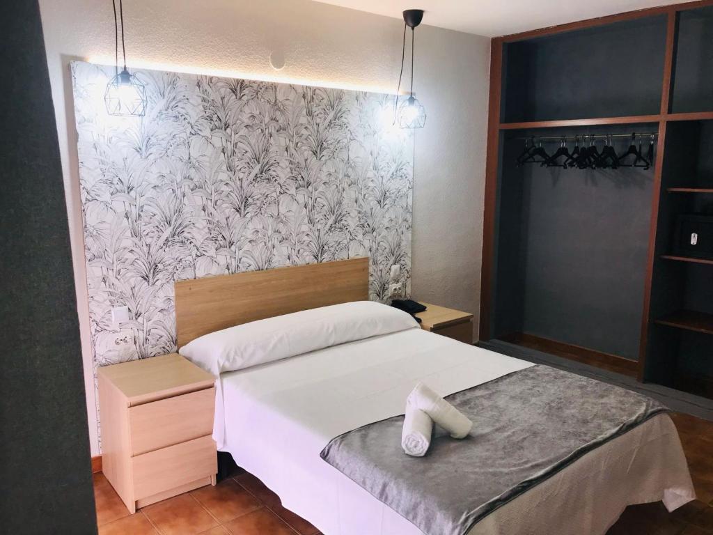 Postel nebo postele na pokoji v ubytování Hotel Arillo