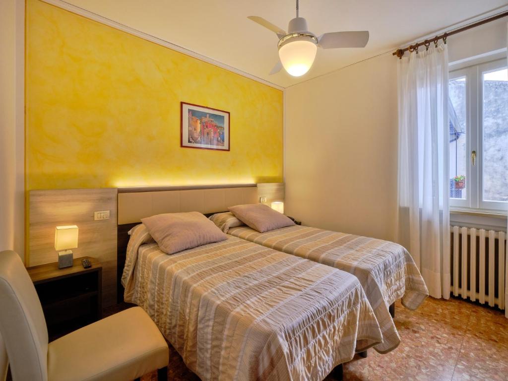 Postel nebo postele na pokoji v ubytování Piccolo Hotel