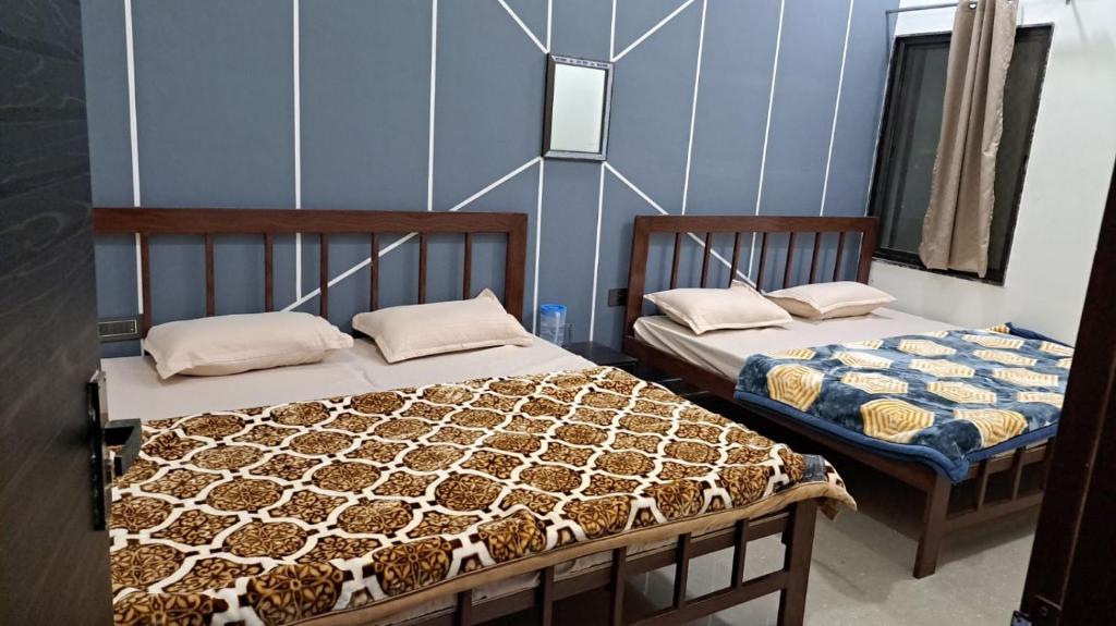 Krevet ili kreveti u jedinici u okviru objekta HOTEL SHREE JEE PALACE