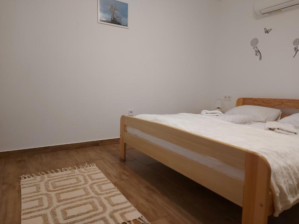 Posteľ alebo postele v izbe v ubytovaní Potyka Apartman