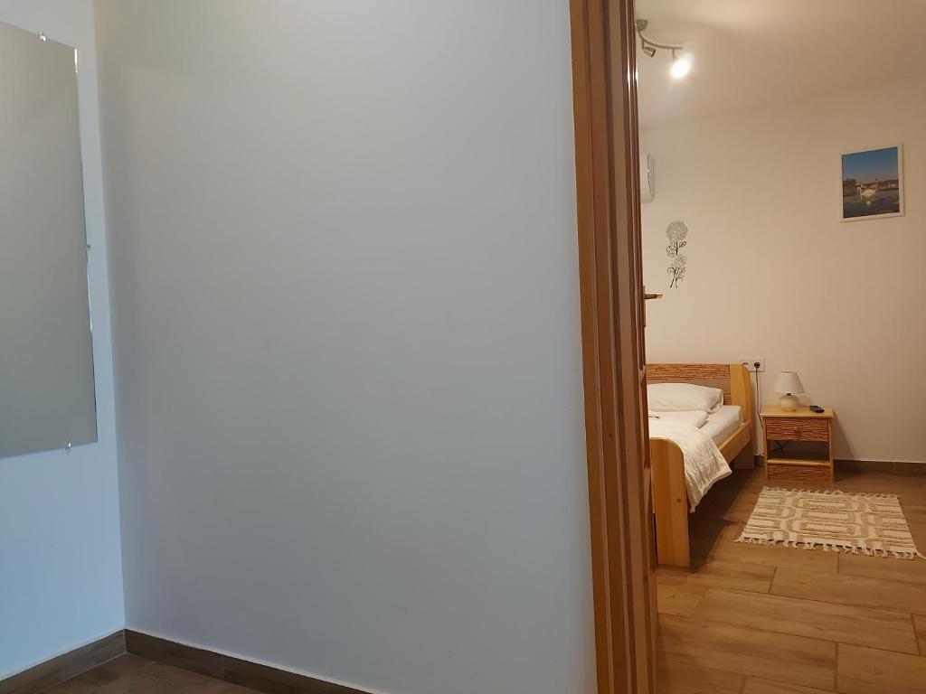 Posteľ alebo postele v izbe v ubytovaní Potyka Apartman