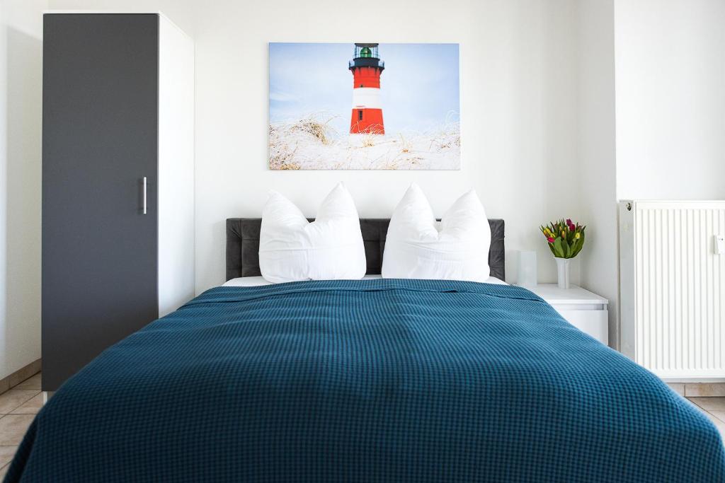 a bedroom with a bed with a red lighthouse at Villa Aida in Ahlbeck