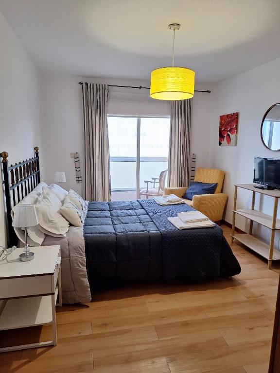 Postel nebo postele na pokoji v ubytování APARTAMENTO VILLA 3