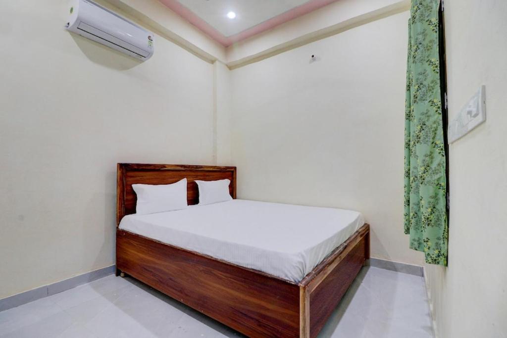 Postel nebo postele na pokoji v ubytování Chainbai Palace