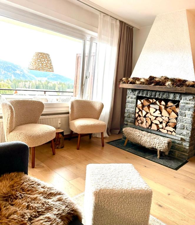 Posezení v ubytování Window on Crans Montana, Appartement avec vue sur les Alpes