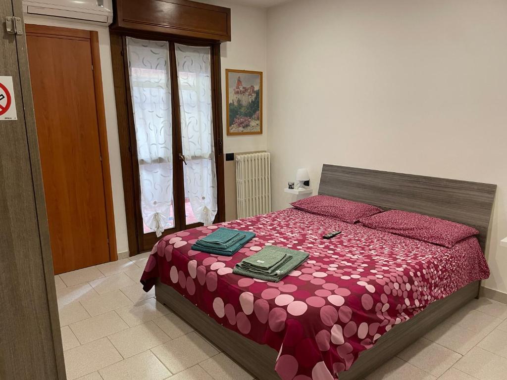 Postel nebo postele na pokoji v ubytování Casa Pompei