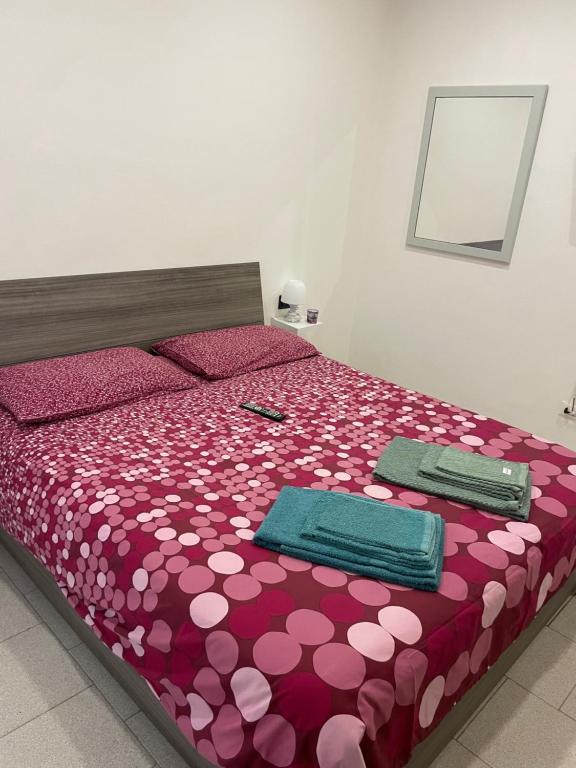 Postel nebo postele na pokoji v ubytování Casa Pompei