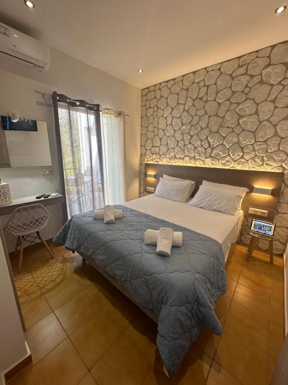 Posteľ alebo postele v izbe v ubytovaní Vladimiros Apartments