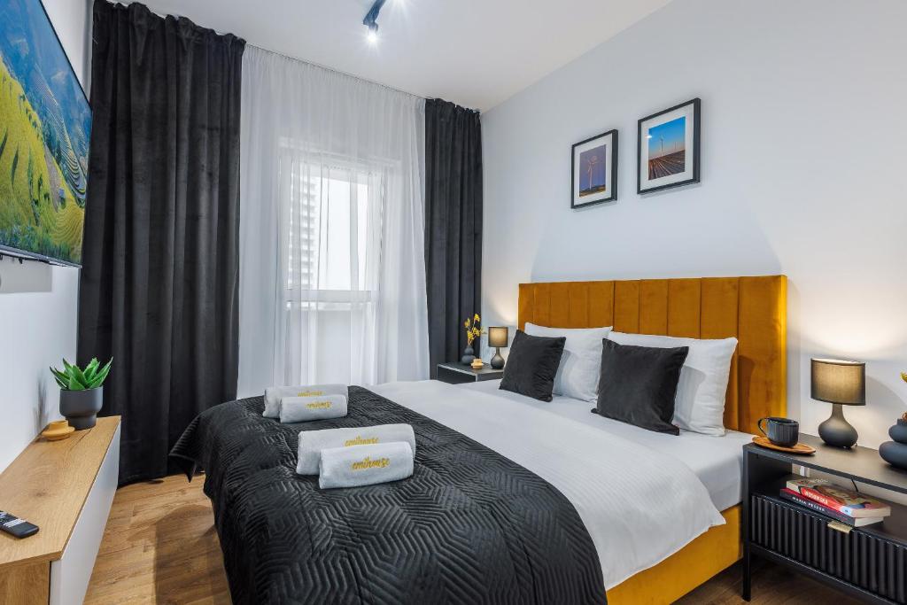 Postel nebo postele na pokoji v ubytování Emihouse Riverside Apartments