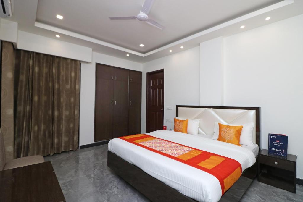 a bedroom with a large bed in a room at Jagat Residency in Rājpur