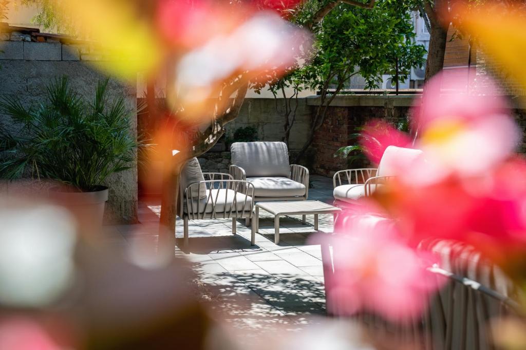 a patio with two chairs and a table at Azur Palace Luxury Rooms in Split