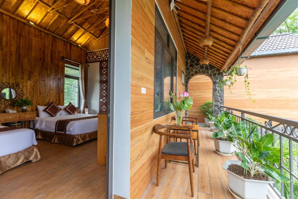 Postel nebo postele na pokoji v ubytování Tam Coc Serenity Hotel & Bungalow