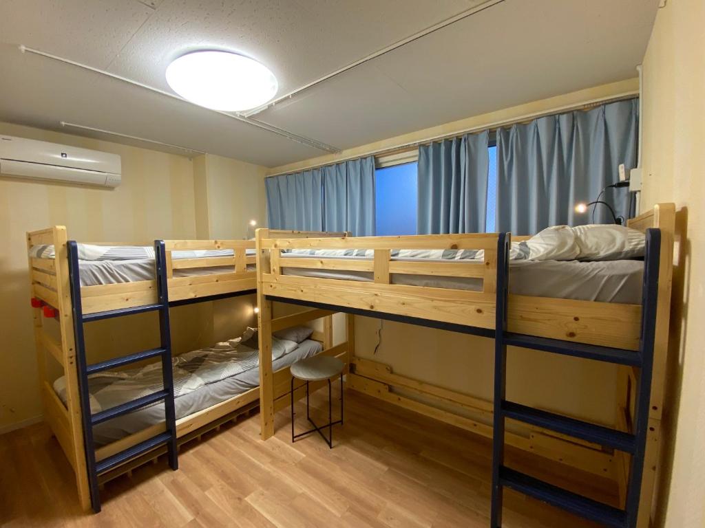 Postel nebo postele na pokoji v ubytování Fukuoka Tabiji Hostel & Guesthouse