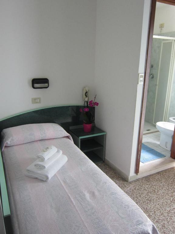 Postel nebo postele na pokoji v ubytování Hotel Concordia Palace