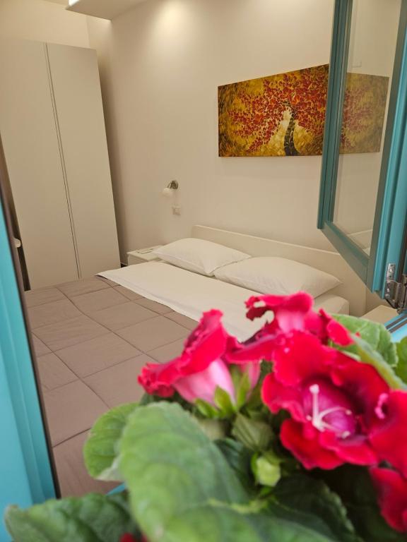 Postel nebo postele na pokoji v ubytování B&B Mormina