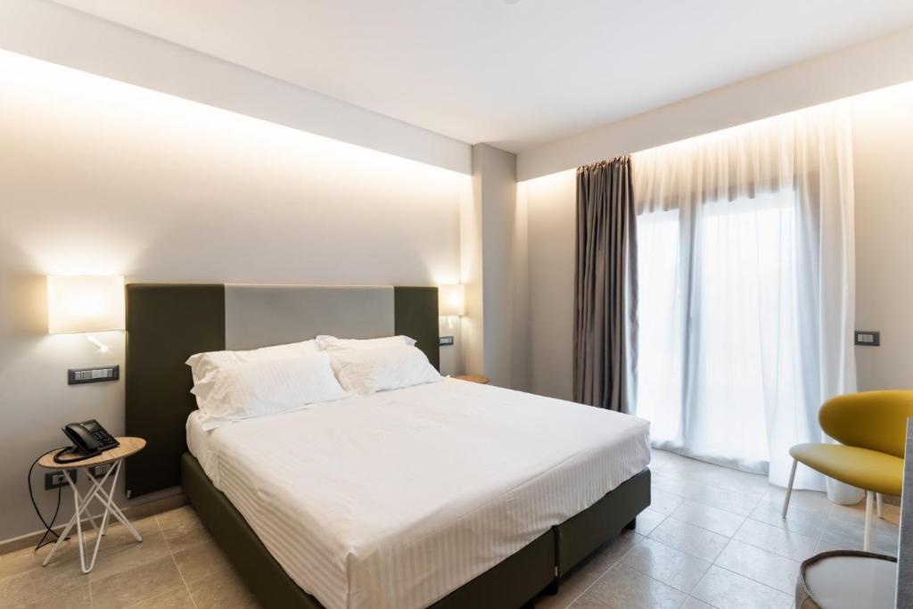 Postel nebo postele na pokoji v ubytování Hotel Netum Mare