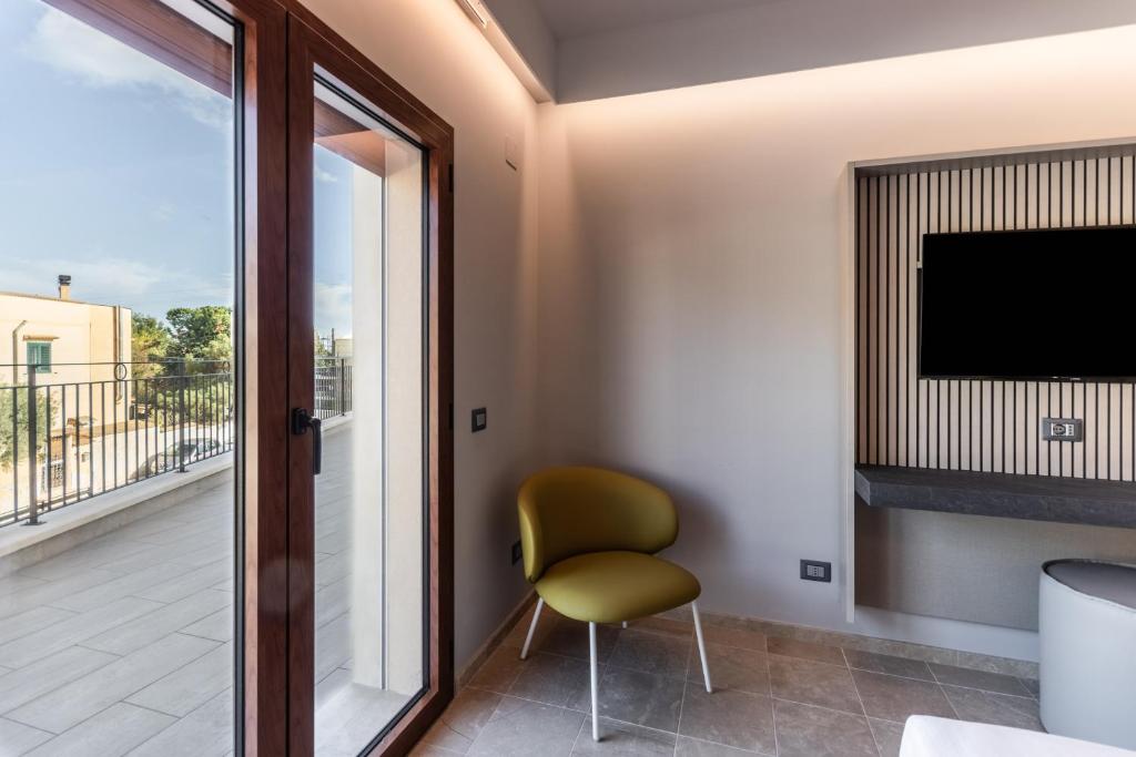 TV a/nebo společenská místnost v ubytování Hotel Netum Mare