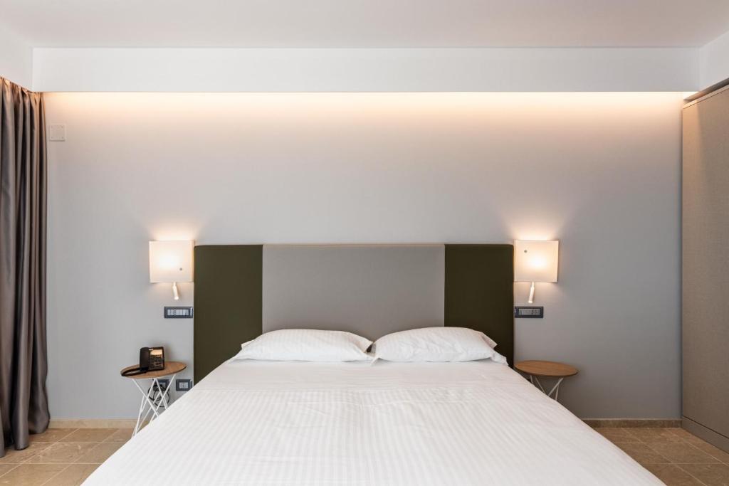 Postel nebo postele na pokoji v ubytování Hotel Netum Mare