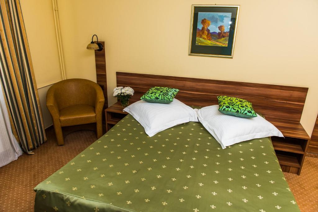 Postel nebo postele na pokoji v ubytování Hotel Lyra