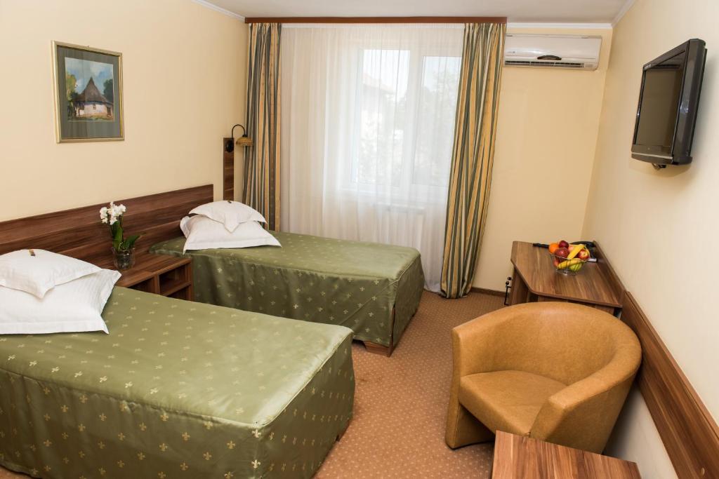 Postel nebo postele na pokoji v ubytování Hotel Lyra