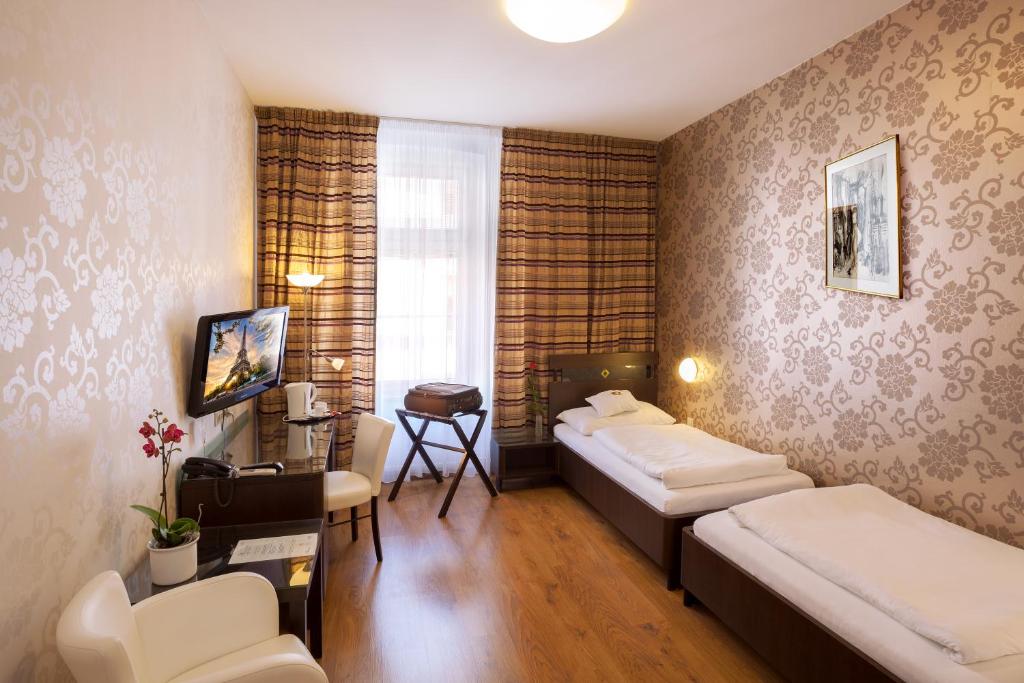 TV a/nebo společenská místnost v ubytování Hotel Trinity