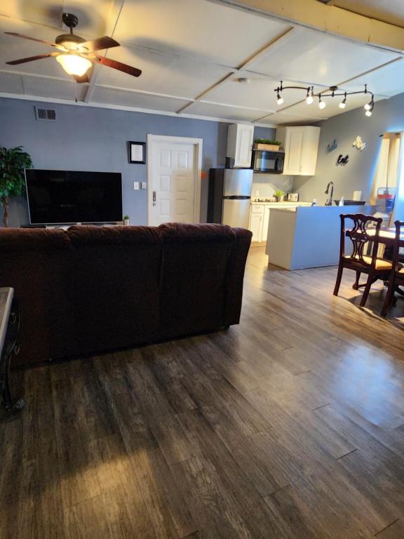 a living room with a couch and a kitchen at Dolan Springs, Grand Canyon Skywalk in Dolan Springs