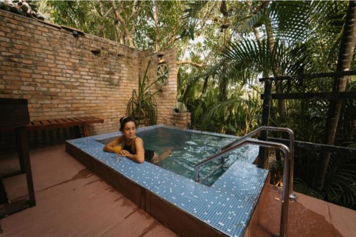 a woman is sitting in a jacuzzi tub at Airport Villa Kamatha -Foreign booking only in Katunayake