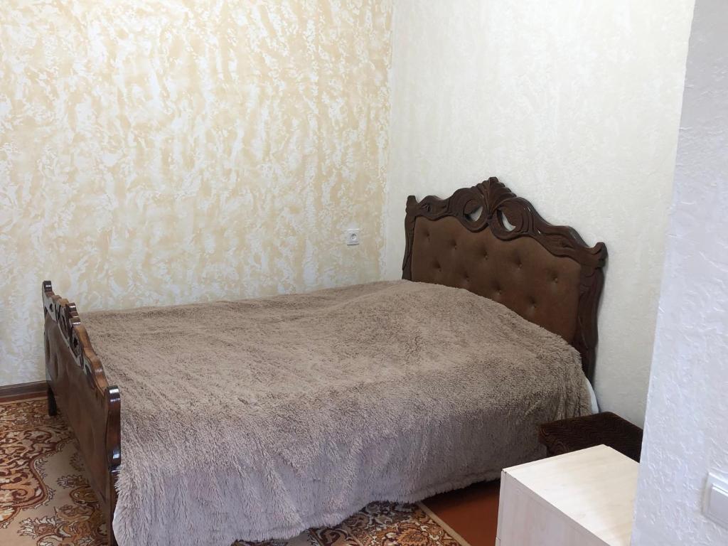 a bedroom with a bed in a room at Sweet house in Gyumri