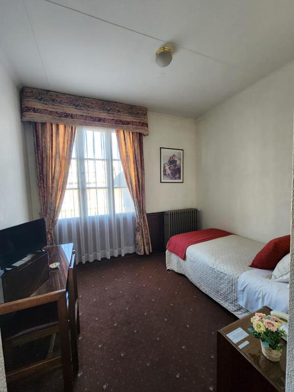 Postel nebo postele na pokoji v ubytování Hotel Mercurio