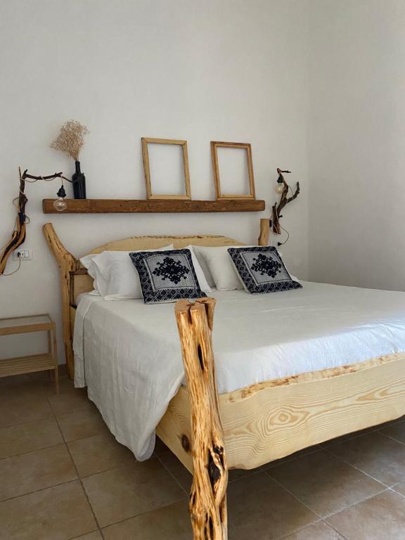 Postel nebo postele na pokoji v ubytování I Ginepri