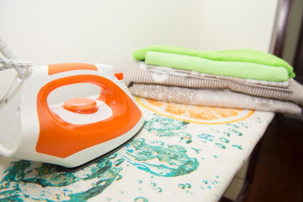 a tea kettle sitting on top of a table with towels at SEVER 555 in Astana