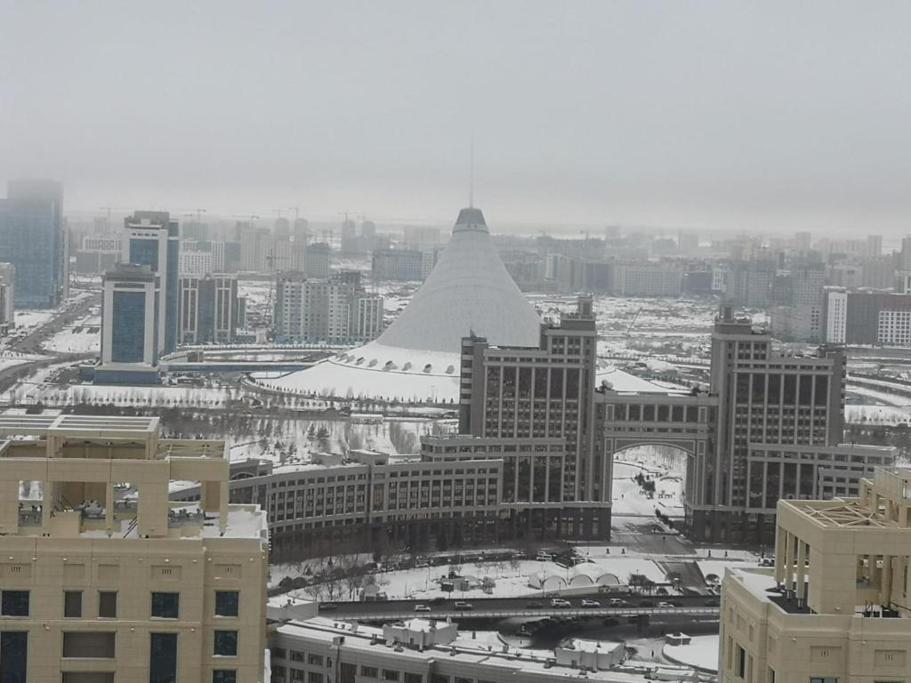 a view of a city with a large building at SEVER 555 in Astana