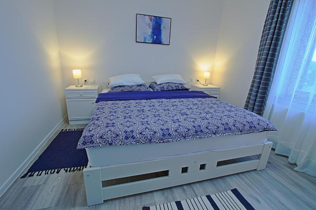 Posteľ alebo postele v izbe v ubytovaní Holiday Home Sinac
