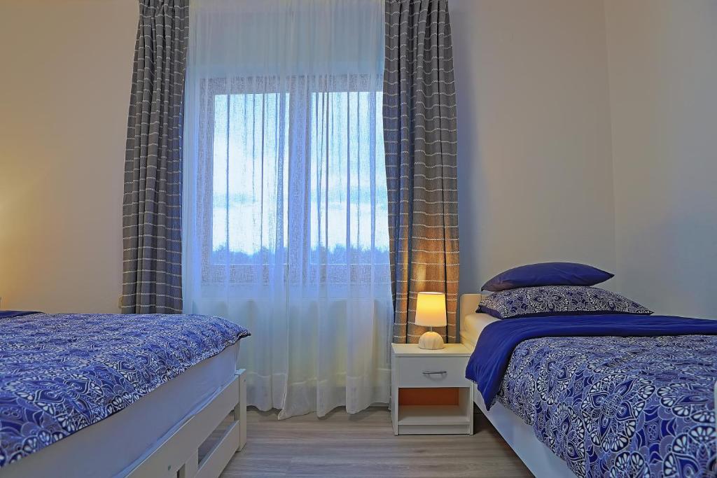 Posteľ alebo postele v izbe v ubytovaní Holiday Home Sinac