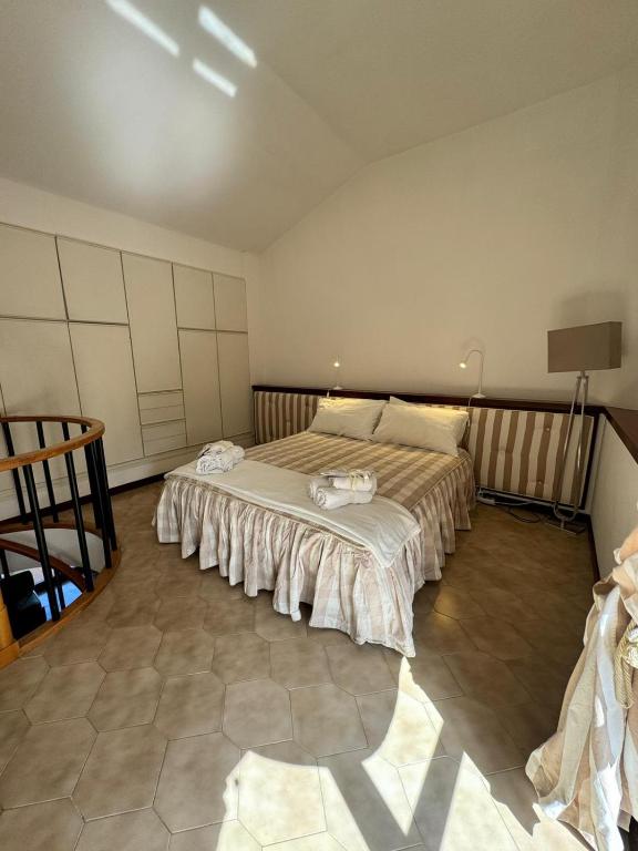 a bedroom with a large bed in a room at Casa Wizzy in Vico Equense