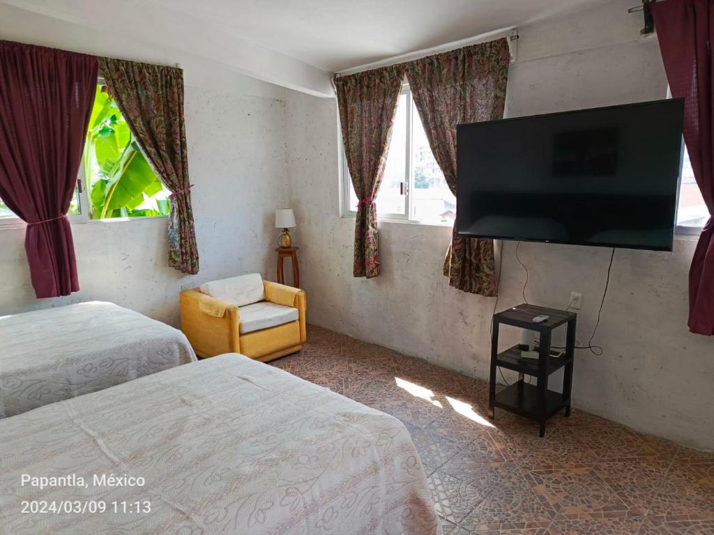 Postel nebo postele na pokoji v ubytování Posada Familiar Papantla