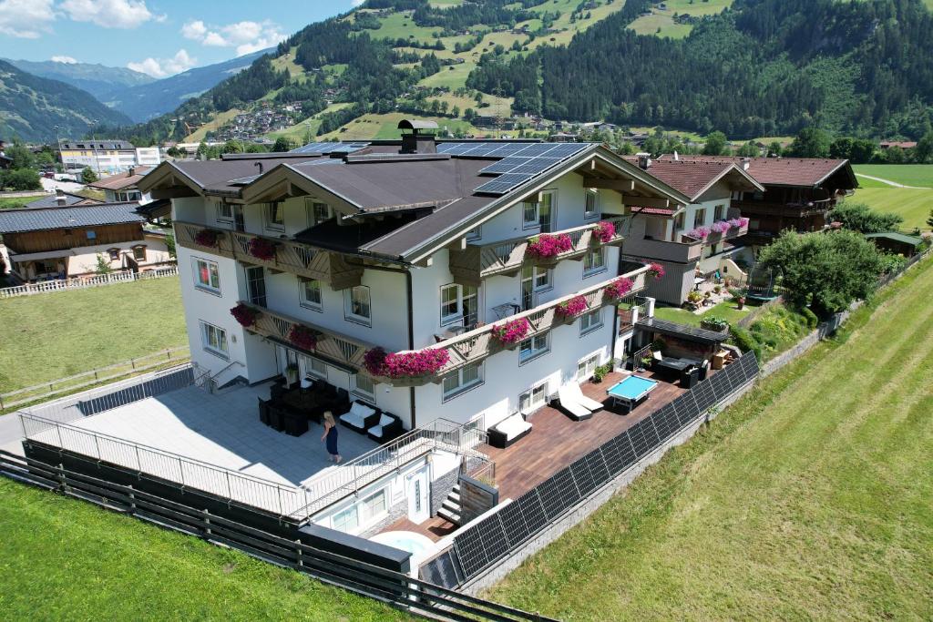 an aerial view of a house in a field at Appartements Olympia in Mayrhofen