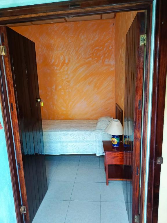 Postel nebo postele na pokoji v ubytování Posada Familiar Papantla