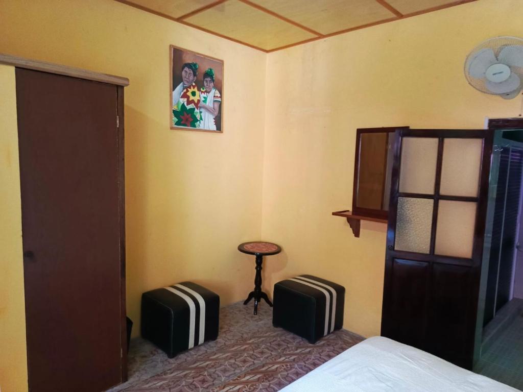 Postel nebo postele na pokoji v ubytování Posada Familiar Papantla