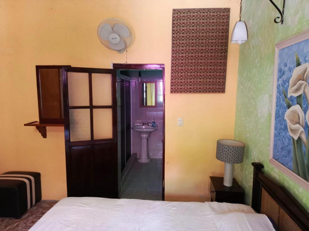 Postel nebo postele na pokoji v ubytování Posada Familiar Papantla