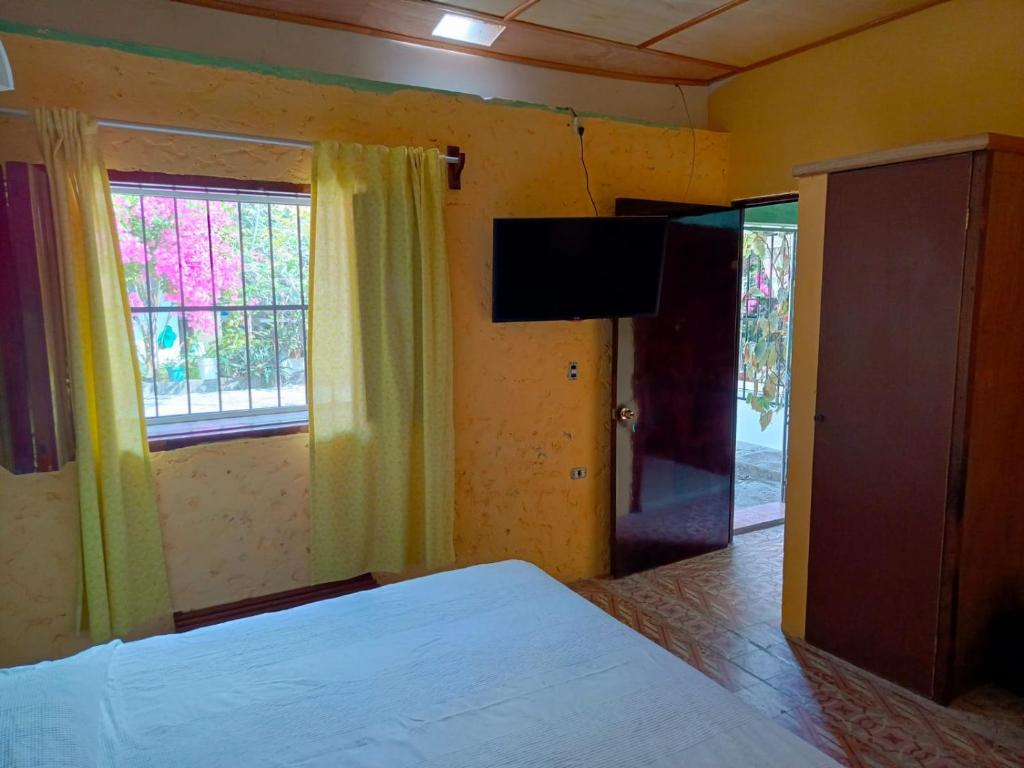Postel nebo postele na pokoji v ubytování Posada Familiar Papantla