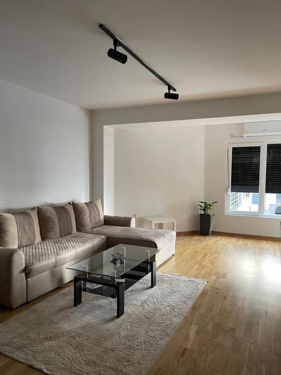 a living room with a couch and a coffee table at Diamond Apartment in Strumica
