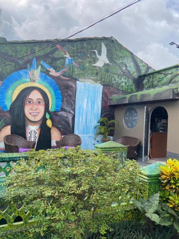 a mural on the side of a building at Aldeia Hostel II in Manaus