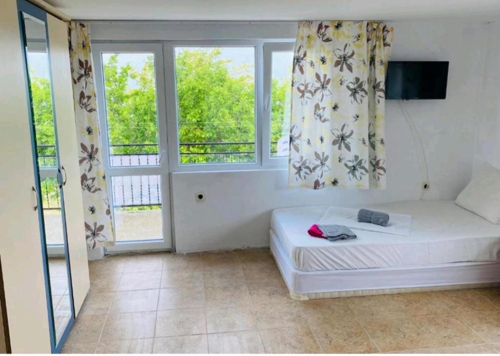Postel nebo postele na pokoji v ubytování Krimski Guest House and Bungalows