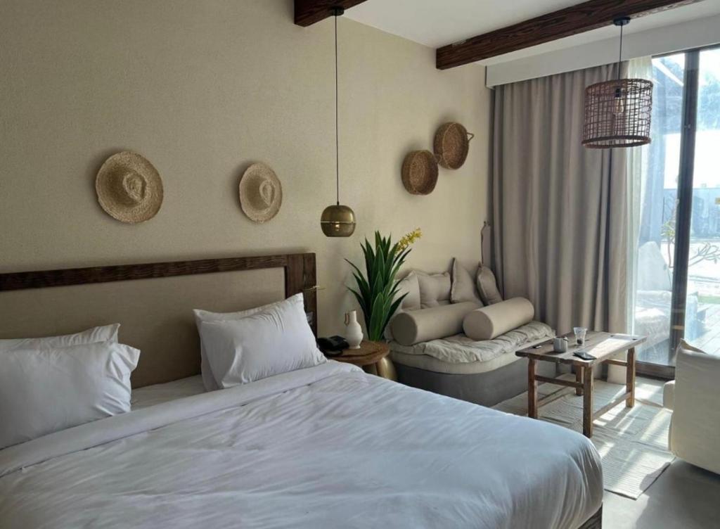 Ένα ή περισσότερα κρεβάτια σε δωμάτιο στο Le Sidi Cabana ( hacienda bay )