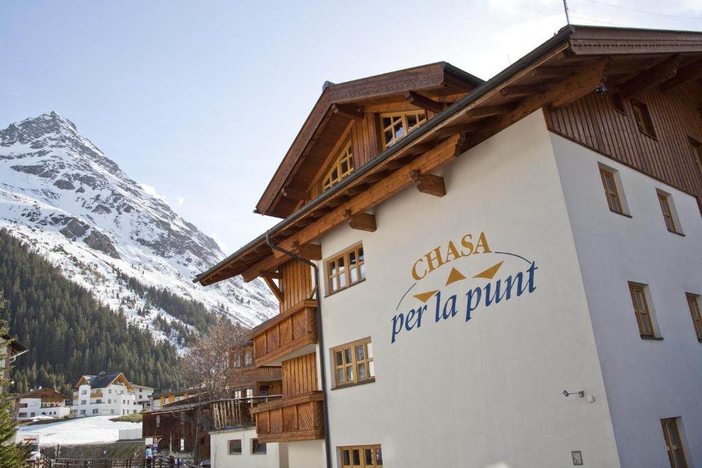 a building with a sign on the side of it at Chasa Per La Punt in Galtür